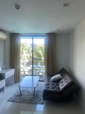 a living room with a couch and a table at Phuket, The Pixcel Cape Panwa Condo in Ban Ao Makham