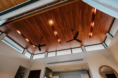 two fans on the ceiling of a house at Botanic Modern loft Villa Private Pool 10 min BangTao in Ban Pak Lak