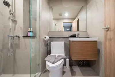 a bathroom with a toilet and a sink and a shower at New studio near Boat Avenue by Lofty in Bang Tao Beach