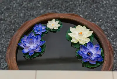 a mirror with a bunch of flowers in it at First Ao Nang Private Pool Villa in Ao Nang Beach