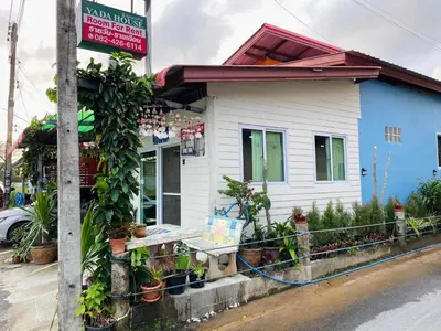 a small blue and white building with a sign on it at Yada House Sunny Place in Ban Bo Han