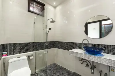 a bathroom with a shower and a toilet and a mirror at V232 Private 4BR Pool Villa Near Big Buddha&Gym in Chalong