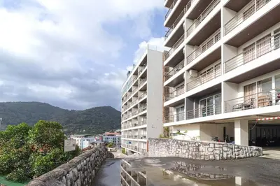 arial view of a building with mountains in the background at C229 1BR Studio Sea View 850m to Beach Gym in Patong Beach