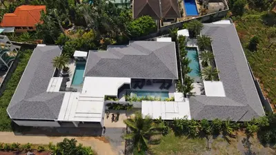 an overhead view of a house with a black roof at Andaman Paradise 1 - Luxury 3-Bedrooms Pool Villa in Rawai Beach