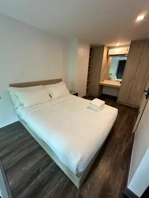 a large white bed in a room with a window at Modern apartment Utopia Naiharn (A22) in Rawai Beach