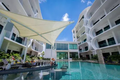 a swimming pool in the middle of a building at Modern apartment Utopia Naiharn (A22) in Rawai Beach