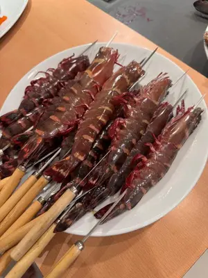 a plate of food on a table with chopsticks at Kamala Beach Front Sea View 6 Bedroom Villa in Kamala Beach