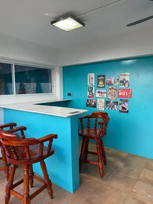 a kitchen with a blue counter and two stools at Tropical 2BR Villa Sunset & Sea View in Karon Beach