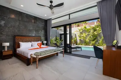 a bedroom with a bed and a sliding glass door at Andaman Paradise 2 Luxury 4 Bedrooms Pool Villa in Rawai Beach