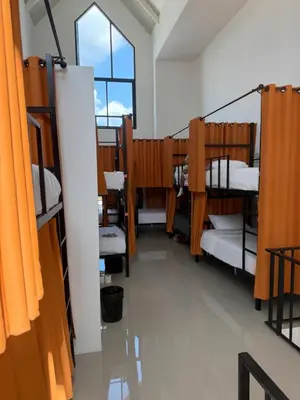 a row of bunk beds in a dorm room at Global Beach Hostel - Ao Nang in Ban Khlong Haeng