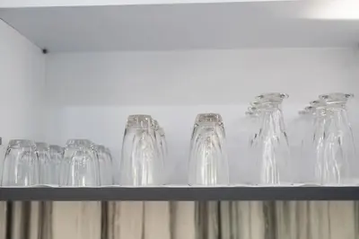 a row of glass bottles sitting on a shelf at Andaman Paradise 3 - Luxury 4 Bedrooms Pool Villa in Rawai Beach