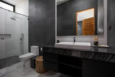 a bathroom with a sink and a toilet and a mirror at Andaman Paradise 3 - Luxury 4 Bedrooms Pool Villa in Rawai Beach