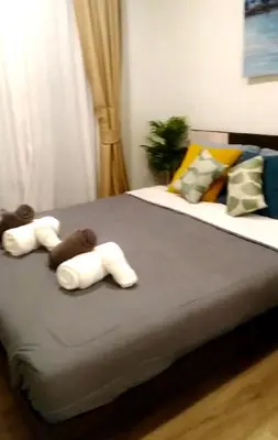a bed with two teddy bears on top of it at \u9876\u7ea7\u9ad8\u5c14\u592b\u7403\u573a\u98ce\u666f in Phuket