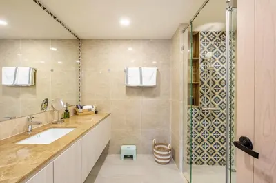 a bathroom with a sink and a shower at The Ozone Condotel Phuket BangTao Beach Spacious 1-BR in Laguna Phuket
