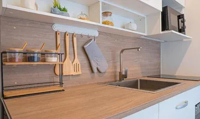 a kitchen with a sink and a counter with utensils at SeaView 1BR Apartment at Karon Beach in Karon Beach