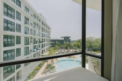 a view of a pool from a window in a hotel at Modern studio in Rawai 600m from the beach in Rawai Beach