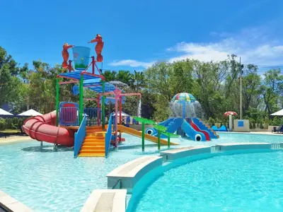 a swimming pool with a water park with slides and slidesktop at Modern studio in Rawai 600m from the beach in Rawai Beach