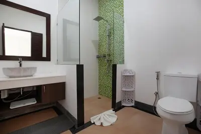 a bathroom with a toilet and a sink and a shower at La Ferme Villa - Modern 3 Bedrooms with Private Pool in Rawai Beach