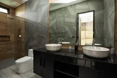 two sinks on a counter in a bathroom with a toilet at Lynn Villa - 3 Bedrooms with Private Pool in Rawai Beach