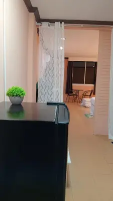 a room with a black counter with a plant on it at Haweli Restaurant & Guest House in Ao Nang Beach
