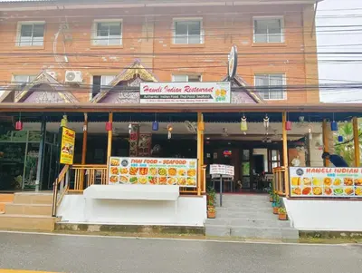 a store front of a building on a street at Haweli Restaurant & Guest House in Ao Nang Beach