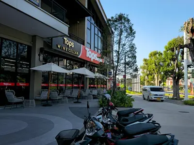 a row of motorcycles parked in front of a building at Title HALO 1 - Modern 1BR Pool View Walk to Nai Yang Beach in Nai Yang Beach