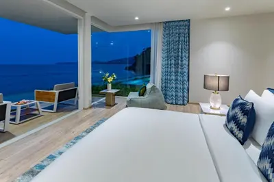 a bedroom with a large bed and a large window at Villa ANDA in Kamala Beach