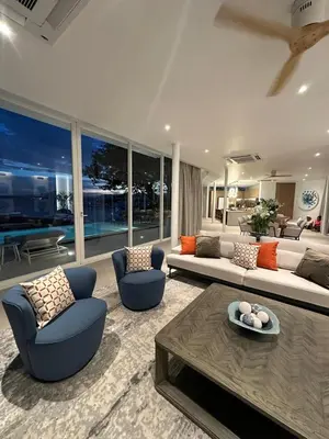 a living room with a couch and chairs and a table at The bay Cape Yamu Villa 2 in Ko Lek