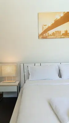 a bedroom with a bed and a table with a lamp at Bangtao Beach 3 bedroom private pool villa in a quiet area near Boat Avenue mono wings in Bang Tao Beach