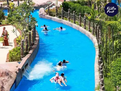 a group of people in a lazy river at a water park at Nature View Residence in Ban Mai Salae