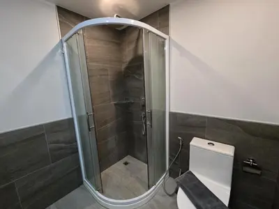 a glass shower in a bathroom with a toilet at Seabreeze Suite 1-Bed T3-637 in Phuket Town