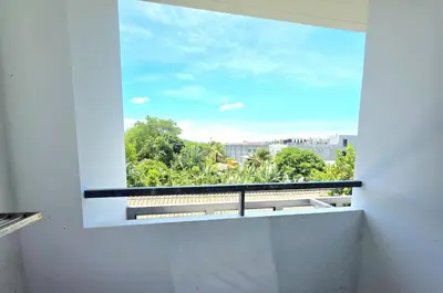 a window with a view of a city at Island Drift Studio T3-332 in Chalong