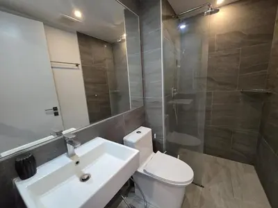 a bathroom with a sink and a toilet and a shower at Palm Bay Studio T3 -532 in Phuket Town