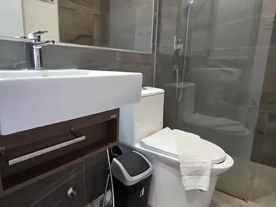 a bathroom with a toilet and a sink and a shower at Urban Tide Studio T3 -626 in Chalong