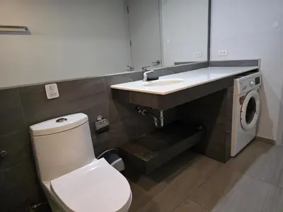 a bathroom with a white toilet and a sink at Skyline Serenity 1Bed T2-721 in Phuket Town