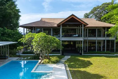 a house with a swimming pool in front of it at Villa Princess Maria in Kata Beach