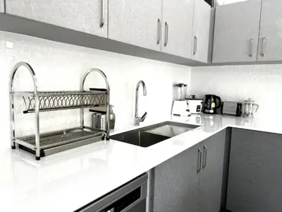 a kitchen with a sink and a counter top at Villa Lola - Modern 3 Bedrooms Villa with Pool in Ban Saiyuan (1)