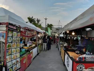 a group of food stalls with people walking between them at GO INN Krabi Ao Nang Beach - โกอินน์ อ่าวนาง in Ban Khlong Haeng