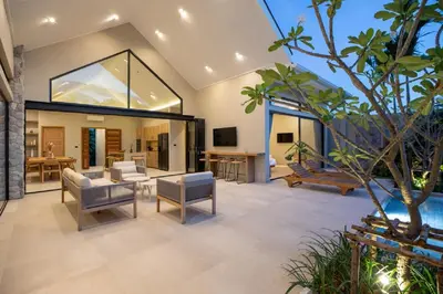an open living room with a couch and chairs at Nomad Villa - Elegant 3 Bedrooms Balinese Pool in Rawai Beach