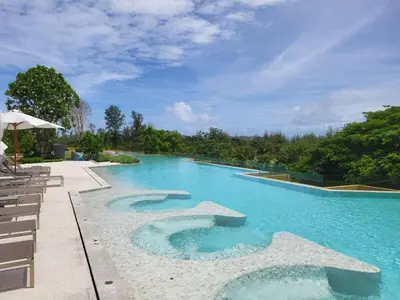 a large swimming pool with blue water at Laguna Residence, Pool View in Bang Tao Beach