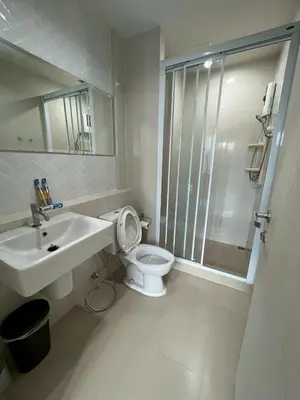 a bathroom with a toilet and a sink and a shower at ห้องวิวเขา in Ban Ket Ho