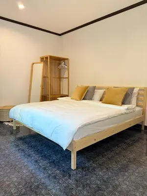 a bedroom with a large bed in a room at Jungle style apartments in Kamala in Kamala Beach