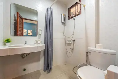 a bathroom with a shower and a toilet and a sink at Serenity Holiday Villa 1 D Karon Beach in Karon Beach