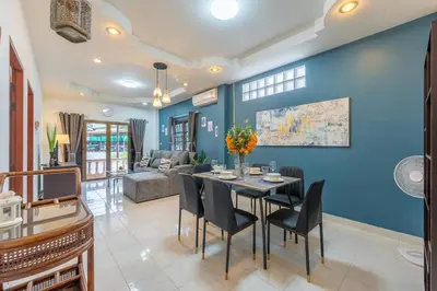 a dining room with a table and chairs at Serenity Holiday Villa 1 D Karon Beach in Karon Beach