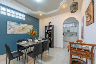 a dining room with a table and chairs at Serenity Holiday Villa 1 D Karon Beach in Karon Beach