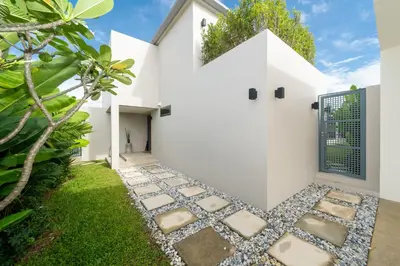 a house with a zen garden with a walkway at Riverhouse Phuket - Private Pool Villas by Escape Villas in Laguna Phuket