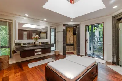 a bathroom with a bed and a large mirror at V238 Villa 6BR Lakefront Jacuzzi Sauna & Gym, Near Beach in Rawai Beach