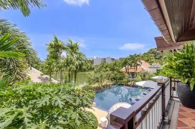 a view of the pool from the balcony of a resort at V238 Villa 6BR Lakefront Jacuzzi Sauna & Gym, Near Beach in Rawai Beach