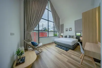 a hotel room with a bed and a desk at New 3BR Pool Villa w Jacuzzi Ao Nang Krabi in Ban Khlong Haeng