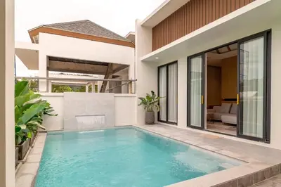 a swimming pool in the backyard of a house at MODERN NEW RELAX VILLA SoL & PooL in Nai Yang Beach